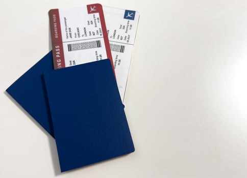 international passport, airplane ticket before grey isolated background photo