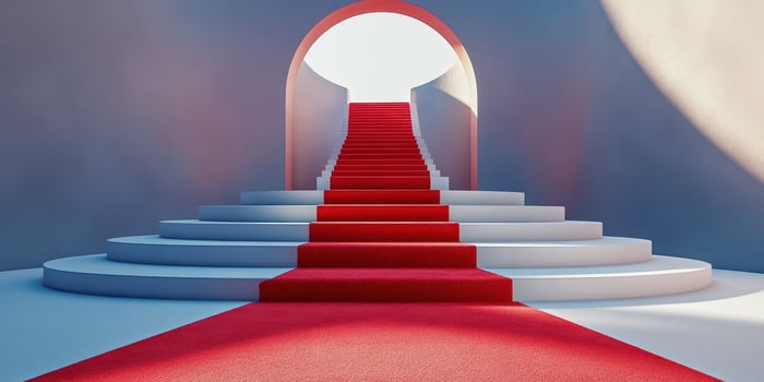 Stairs with red carpet leading to a round arch and bright light, creating an inviting atmosphere for events and ceremonies photo