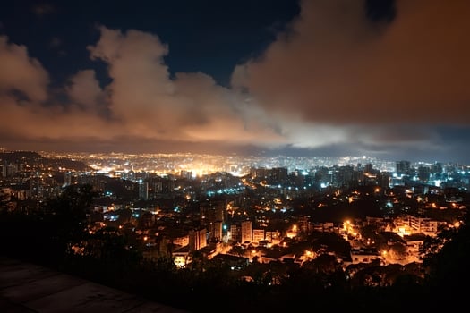 Caracas cityscape illuminating night under cloudy sky in venezuela photo