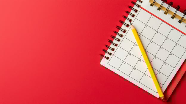Yellow Pencil on Red Calendar Planning and Scheduling Concept photo