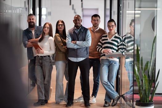 A diverse, multiethnic business team of entrepreneurs and leaders in a modern office, collaborating in an open space. Their teamwork, motivation, and partnership fuel the company's growth and success photo