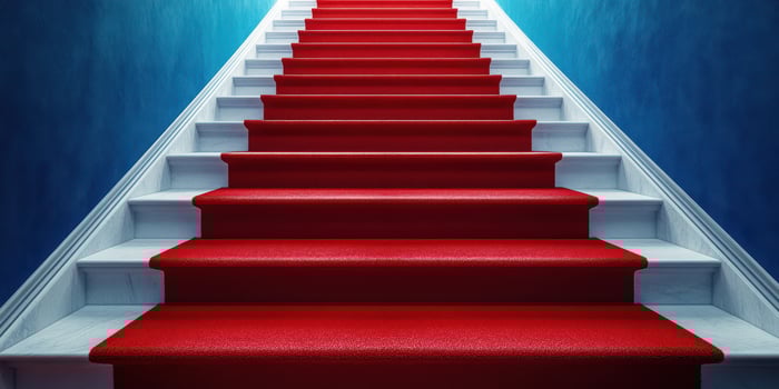 Bold red carpeted stairs leading to a bright blue hallway create a stunning visual impact in a modern indoor setting photo
