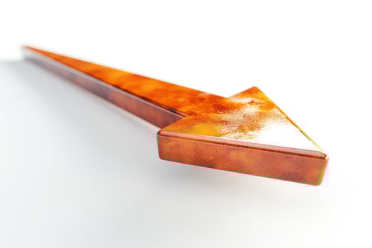A sleek, glossy brown arrow pointing left on a clean white background, symbolizing direction and movement. photo