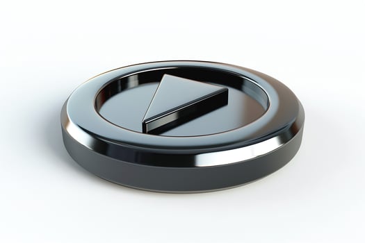 A sleek, modern play button icon in glossy black and silver, symbolizing media playback. photo