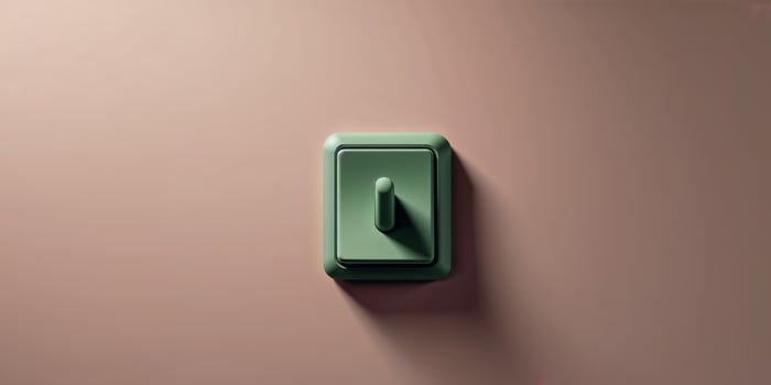 A green light switch on a wall photo