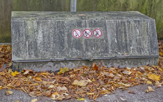 Weathered Concrete Structure with Prohibition Signs photo