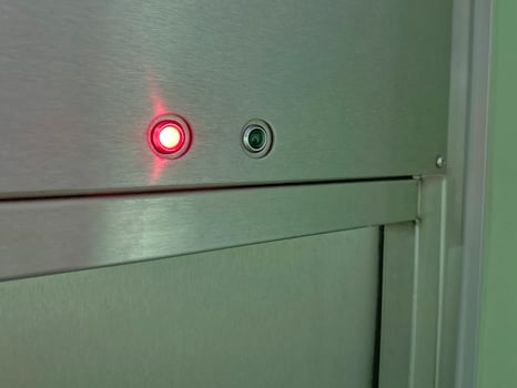 Close-up of Elevator Panel with Red Light and Camera photo