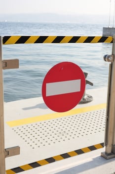 No entry sign on a coastal dock during daylight hours photo