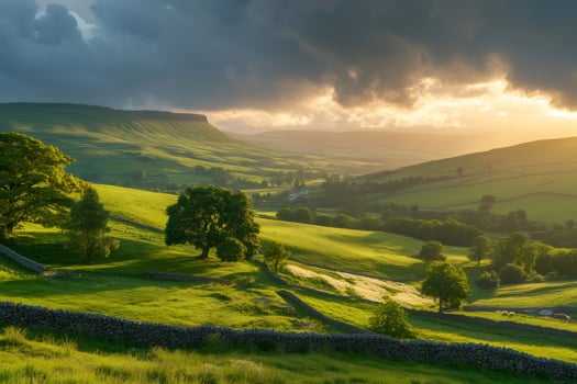 Dramatic sunset illuminating green fields and hills in Yorkshire Dales National Park photo