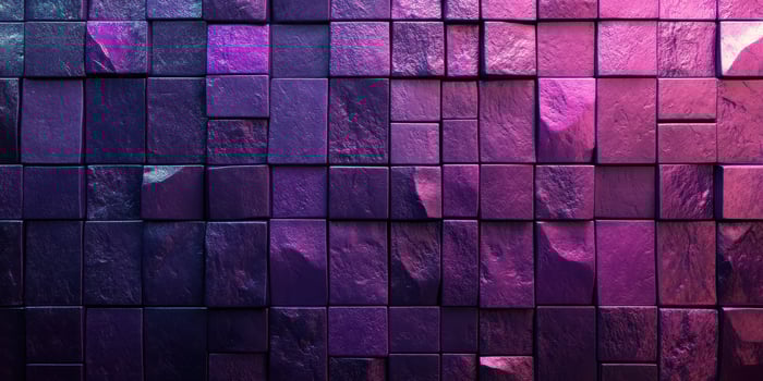 Colorful textured wall composed of square tiles illuminated by purple and pink lights photo