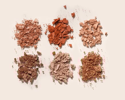 Natural color eye shadow make up palette, crushed face powder swatches. Woman cosmetic and beauty product, aesthetic cosmetics still life beauty photography, beige color eyeshade pattern, above view photo