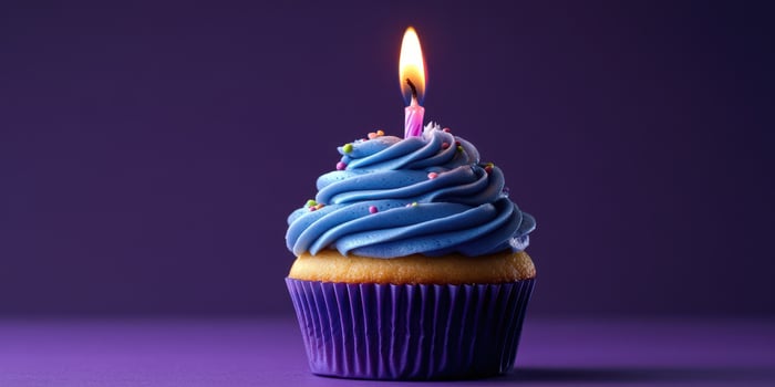 Delicious blue frosted cupcake with a candle celebrating a special occasion in a festive setting photo