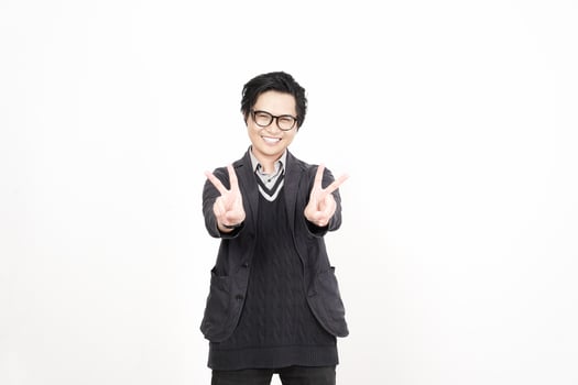 A man in glasses and a sweater is making a peace sign photo