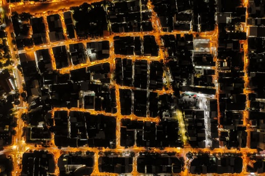 Night shot topview reveals the endless maze of houses and housing that make up the bustling city of Bangkok, each one teeming with activity. shot date 22 Nov 2018 photo