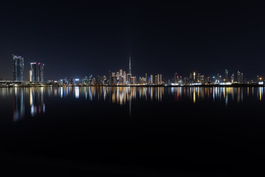 Stunning view of Dubai skyline at night featuring Burj Khalifa and city lights 5 photo