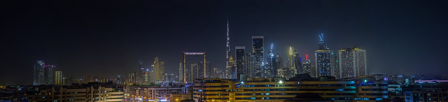 Stunning view of Dubai skyline at night featuring Burj Khalifa and city lights 2 photo