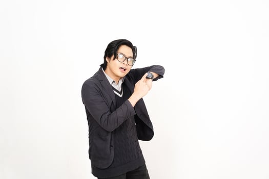 A man in glasses and a sweater is holding his arm up photo