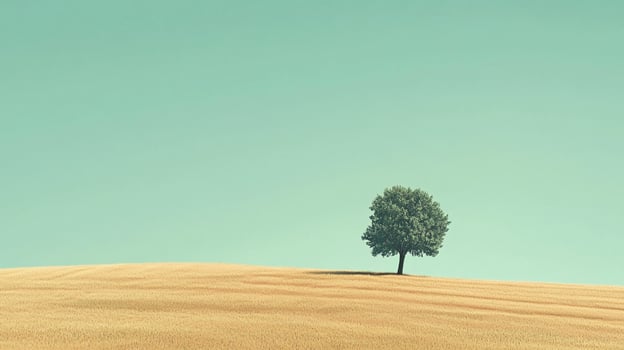 Lonely tree on a golden field underneath a pale green sky, evokes tranquility and space, ideal for contemplation or dreaming. photo