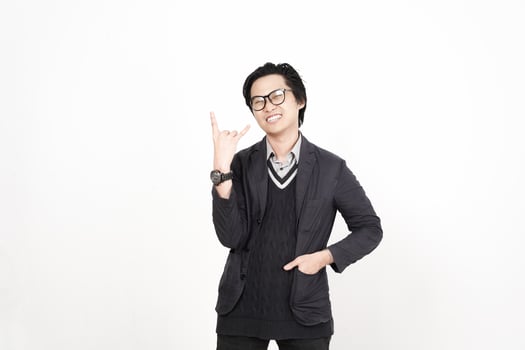 A man in glasses and a sweater is making a peace sign photo