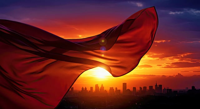 A red flag flying in the wind at sunset photo