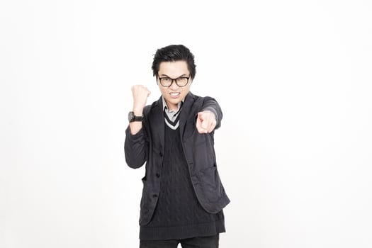 A man in glasses and a black jacket pointing at something photo
