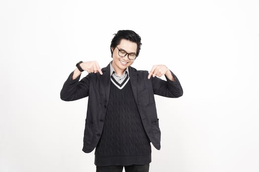 A man in glasses and a sweater is making a gesture photo