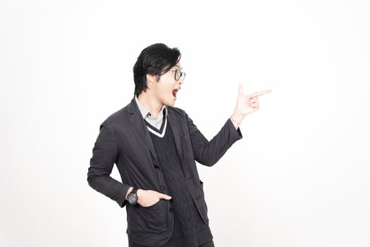 A man in glasses pointing at something photo