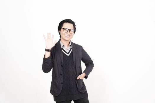 A man in glasses and a sweater waving his hand photo