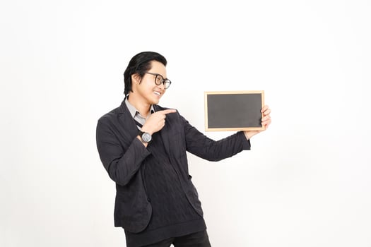 Asian man holding a blackboard and pointing to it photo