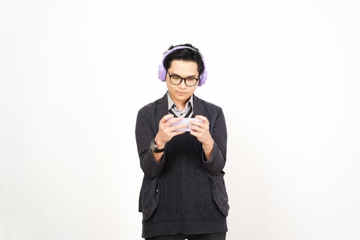 A man wearing headphones and holding a cell phone photo