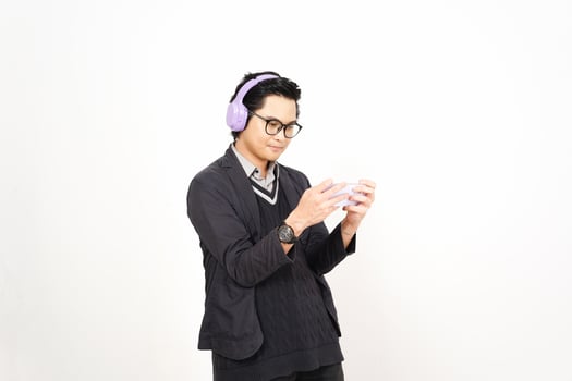 A man wearing headphones and holding a cup photo