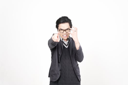 A man in a suit and glasses making a thumbs up photo