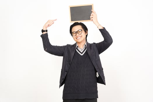 A man holding up a chalkboard with his hands photo