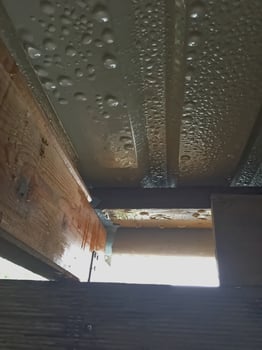 Water Droplets on Metal Roofing and Wooden Beams photo