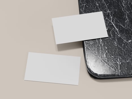 Mockup of business card pair on glossy marble countertop. photo