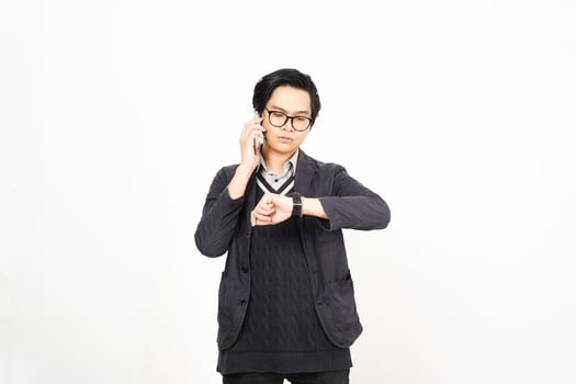 A man in glasses and a sweater is holding his hand to his face photo
