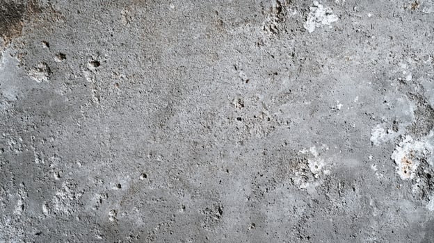 Abstract weathered concrete texture showcases wear and imperfections with varying tonal changes and surface disruptions on the surface. photo