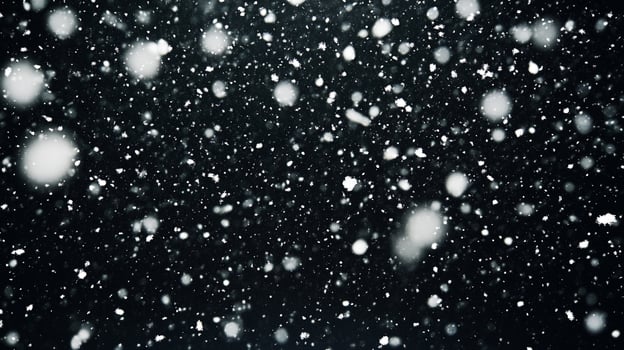 A captivating display of falling snow creates a mesmerizing spectacle in the night. The delicate flakes dance against the darkness. photo