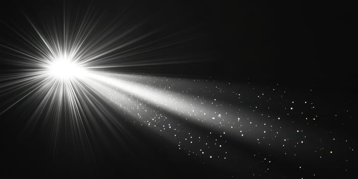 Bright light beam radiating in darkness with sparkling particles in the atmosphere during a nighttime setting photo