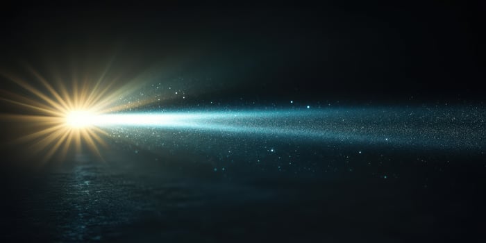 Bright light beams illuminating a dark space with particle effects in motion at a nighttime setting photo