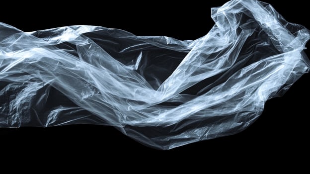 Floating translucent plastic sheet against a void, captured in dynamic lighting and emphasizing its fragile texture and undulating form. photo