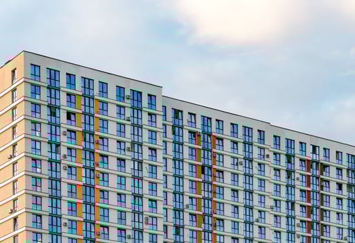 multi-storey building in a metropolitan neighborhood. Modern condominium with balconies and photo