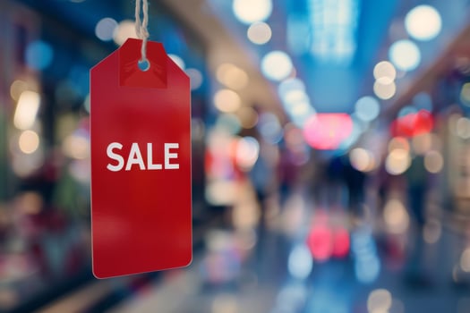 Red sale tag on store window photo