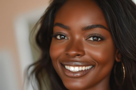 Smiling young Black woman with beautiful skin and long hair, showcasing natural beauty and confidence. photo