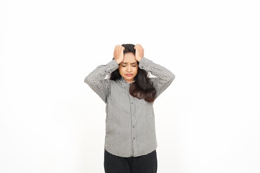 A woman is holding her head with both hands photo