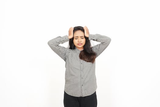 A woman is holding her head with both hands photo
