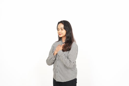 A woman is standing with her hands folded photo