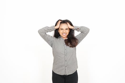 A woman is holding her head with both hands photo