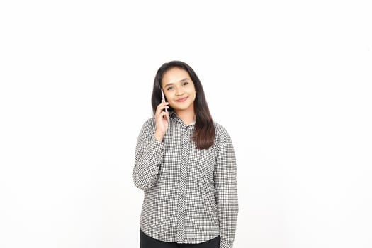A woman in a shirt talking on the phone photo