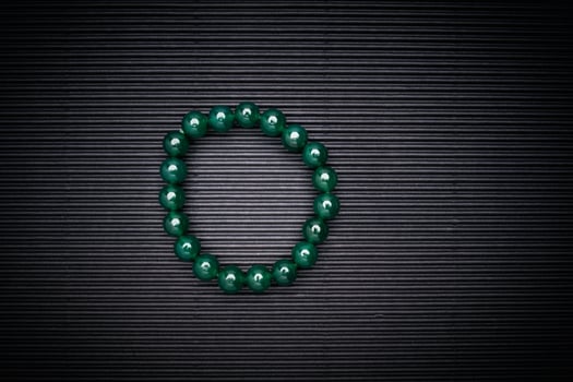 Jade bangles or bracelets on a black background photo